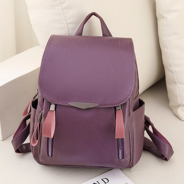 Diebstahlsicherer Lederrucksack für Damen, elegant in Braun, mit verstellbaren Trägern und robusten Reißverschlüssen.