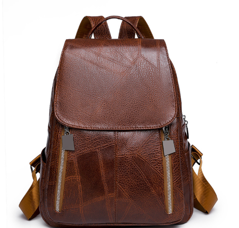 Diebstahlsicherer Lederrucksack für Damen, elegant in Braun, mit verstellbaren Trägern und robusten Reißverschlüssen.