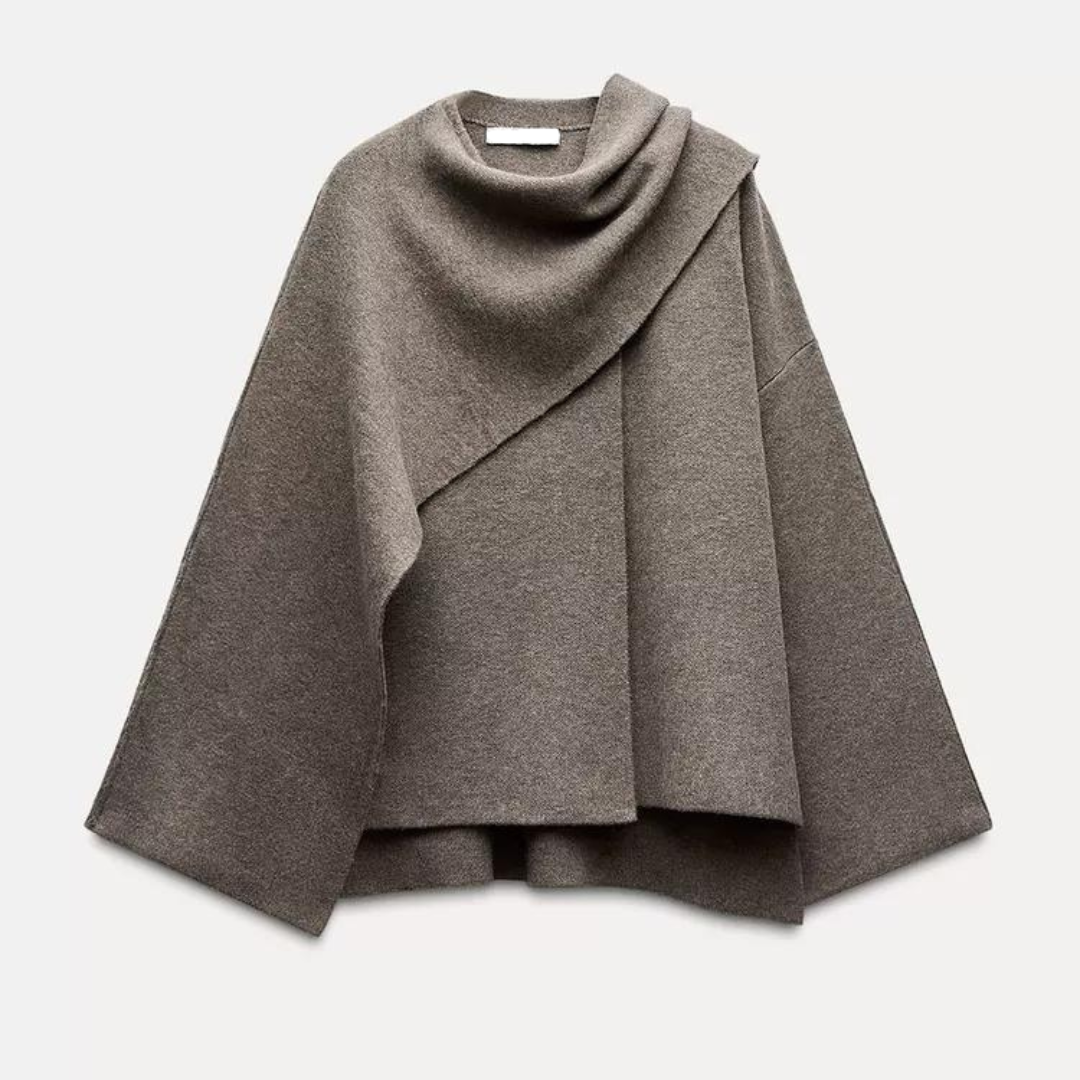 Moderner grauer Cape-Mantel für Frauen, eleganter Schnitt, dekorative Knöpfe, fließender Stoff, stilvoller Look.