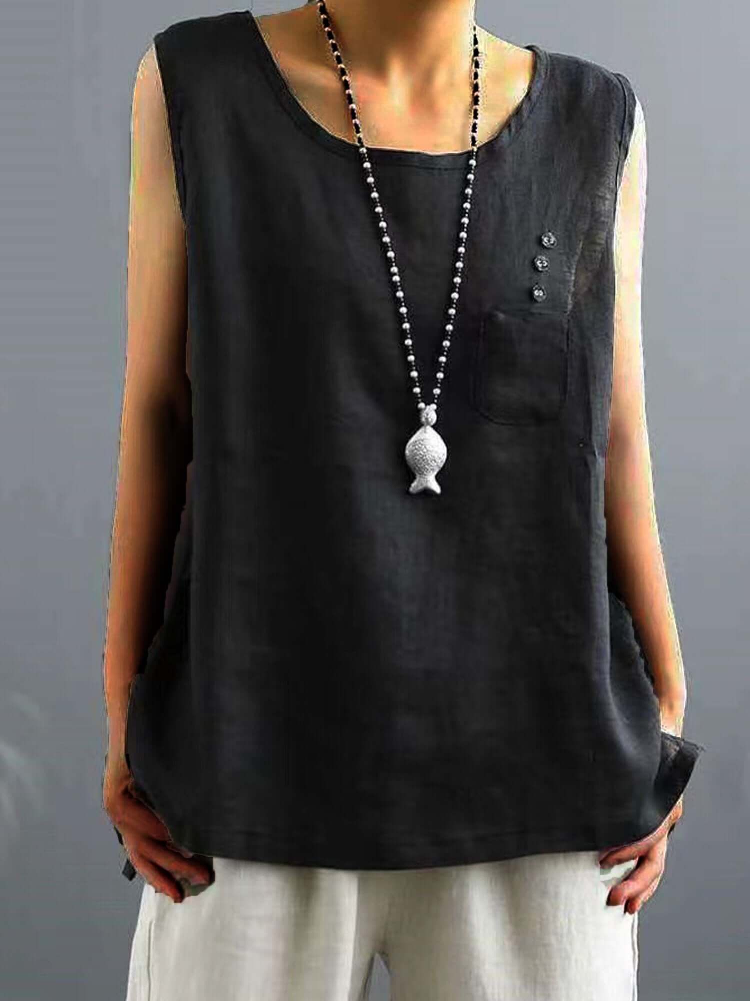 "Ärmelloses, lockeres Vintage T-Shirt aus Baumwolle und Leinen in unifarbenem Design mit Rüschen und Knöpfen."