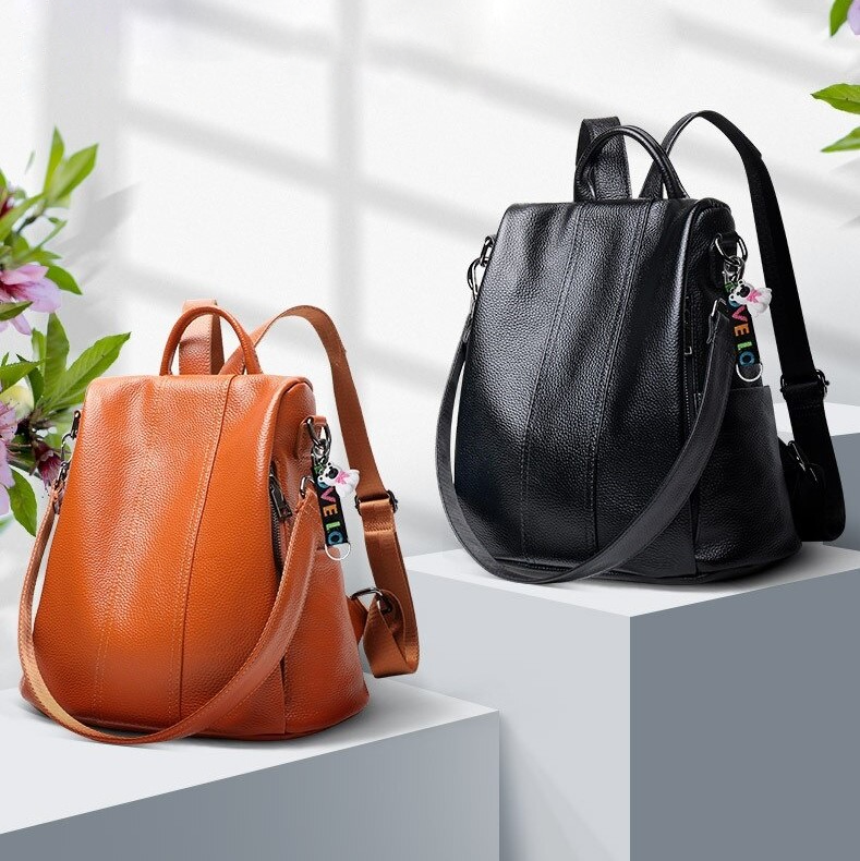 "Diebstahlsicherer Lederrucksack für Damen, braun, flexibel tragbar mit verstecktem Rückenzugang und schnittfestem Design."