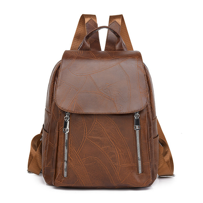 Diebstahlsicherer Lederrucksack für Damen, elegant in Braun, mit verstellbaren Trägern und robusten Reißverschlüssen.